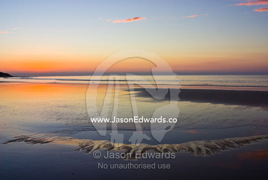 Tide pools reflect dawn's first light. Point Danger, Torquay, Surf Coast, Victoria, Australia.