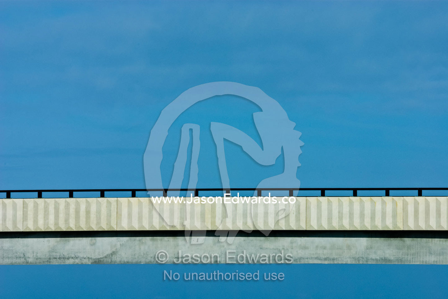A bridge spans an open expanse of blue sky. Eastern and Southeastern Suburbs, Melbourne, Victoria, Australia.