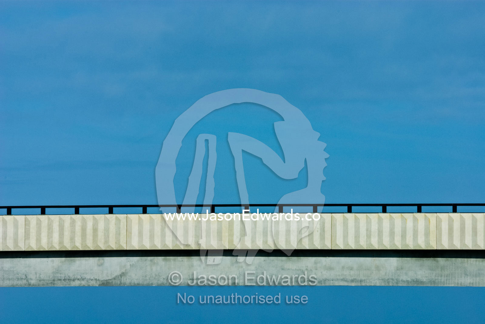 A bridge spans an open expanse of blue sky. Eastern and Southeastern Suburbs, Melbourne, Victoria, Australia.
