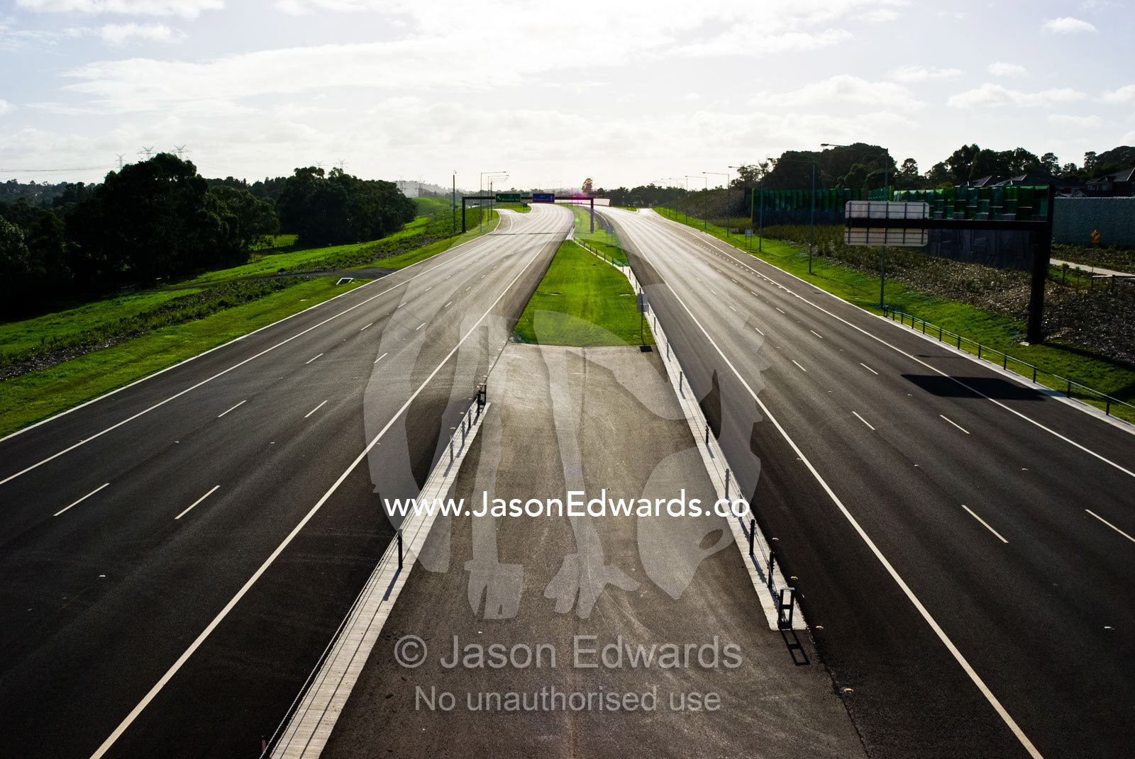A vast freeway devoid of all traffic is silent on a sunny afternoon. Eastern and Southeastern Suburbs, Melbourne, Victoria, Australia.