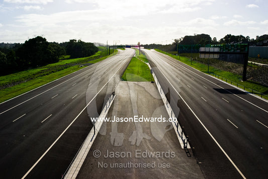 A vast freeway devoid of all traffic is silent on a sunny afternoon. Eastern and Southeastern Suburbs, Melbourne, Victoria, Australia.