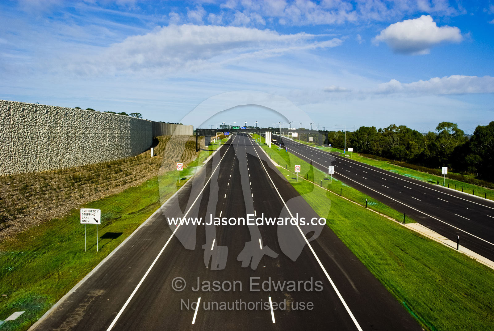A vast freeway devoid of all traffic is silent on a sunny afternoon. Eastern and Southeastern Suburbs, Melbourne, Victoria, Australia.