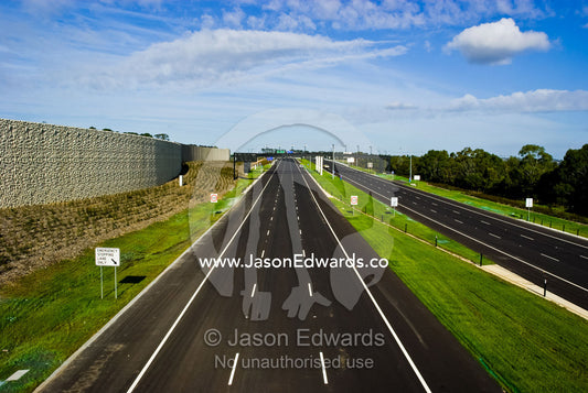 A vast freeway devoid of all traffic is silent on a sunny afternoon. Eastern and Southeastern Suburbs, Melbourne, Victoria, Australia.