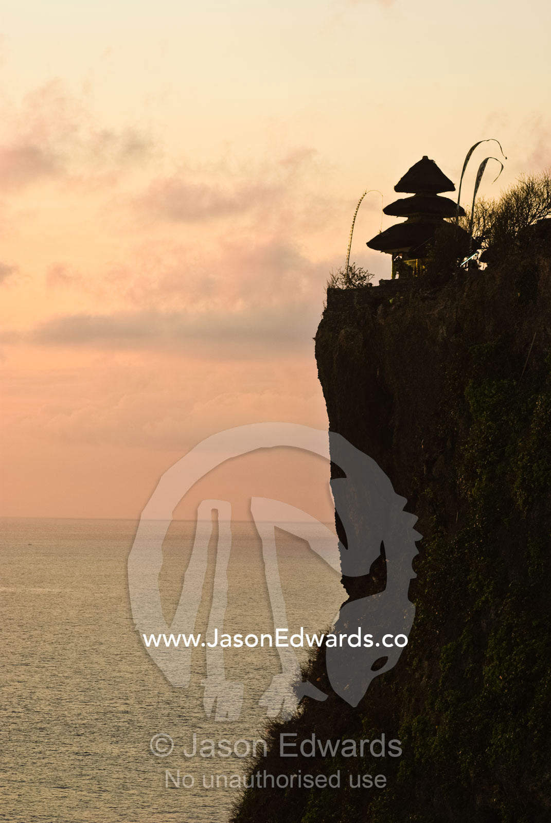The ancient Hindu Pura Luhur Temple on the edge of an ocean cliff. Pura Luhur Temple, Uluwatu, Badung Regency, Bali, Indonesia.