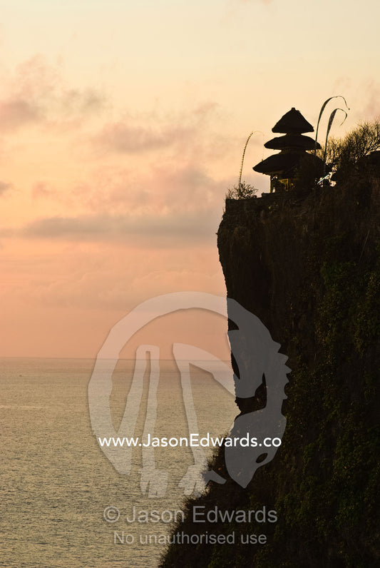 The ancient Hindu Pura Luhur Temple on the edge of an ocean cliff. Pura Luhur Temple, Uluwatu, Badung Regency, Bali, Indonesia.