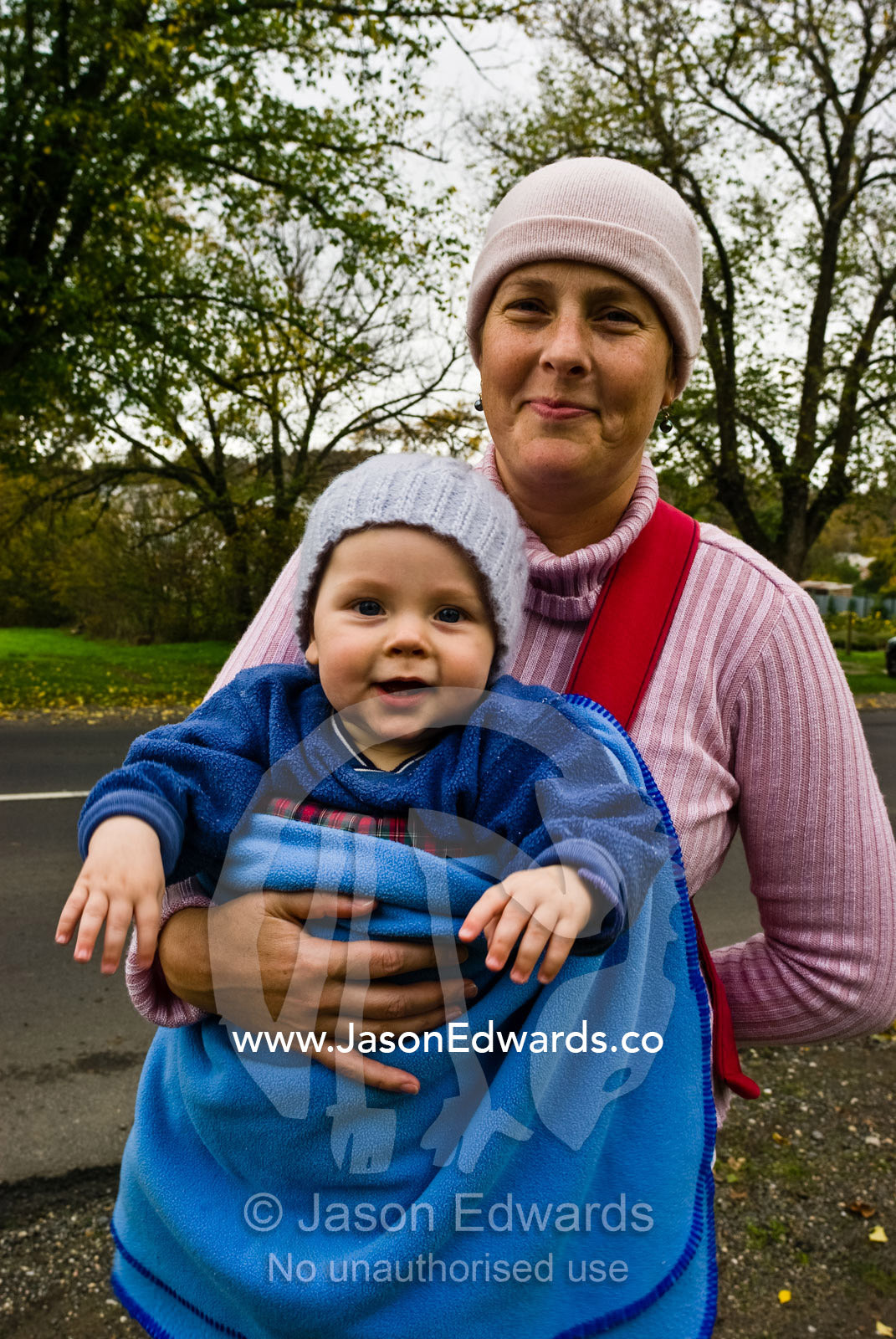 A mother and son rugged-up in woolens to ward off the winter chill. Trentham, Victoria, Australia.