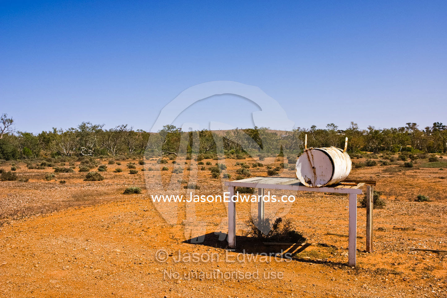 An oil drum letterbox by a desert track on an outback cattle station. Fowlers Gap, New South Wales, Australia.