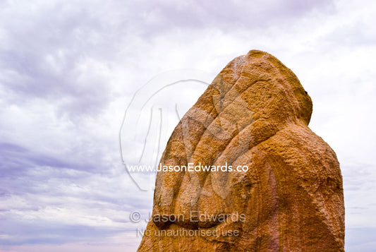 Stone sculptures carved into abstract forms rise into a stormy desert. Living Desert Flora and Fauna Sanctuary, Barrier Ranges, Broken Hill, New South Wales, Australia.