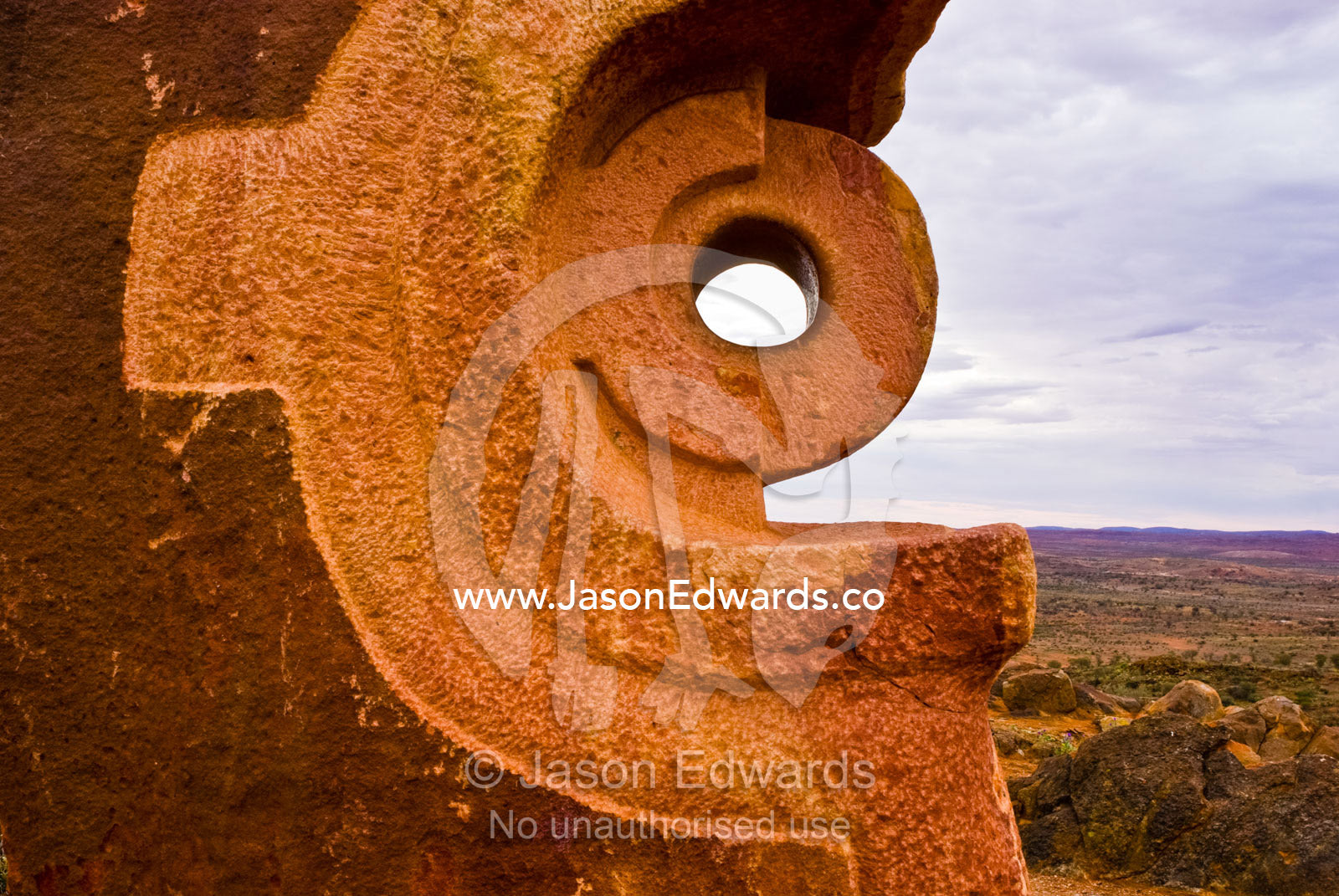 Stone sculptures carved into abstract forms rise into a stormy desert. Living Desert Flora and Fauna Sanctuary, Barrier Ranges, Broken Hill, New South Wales, Australia.