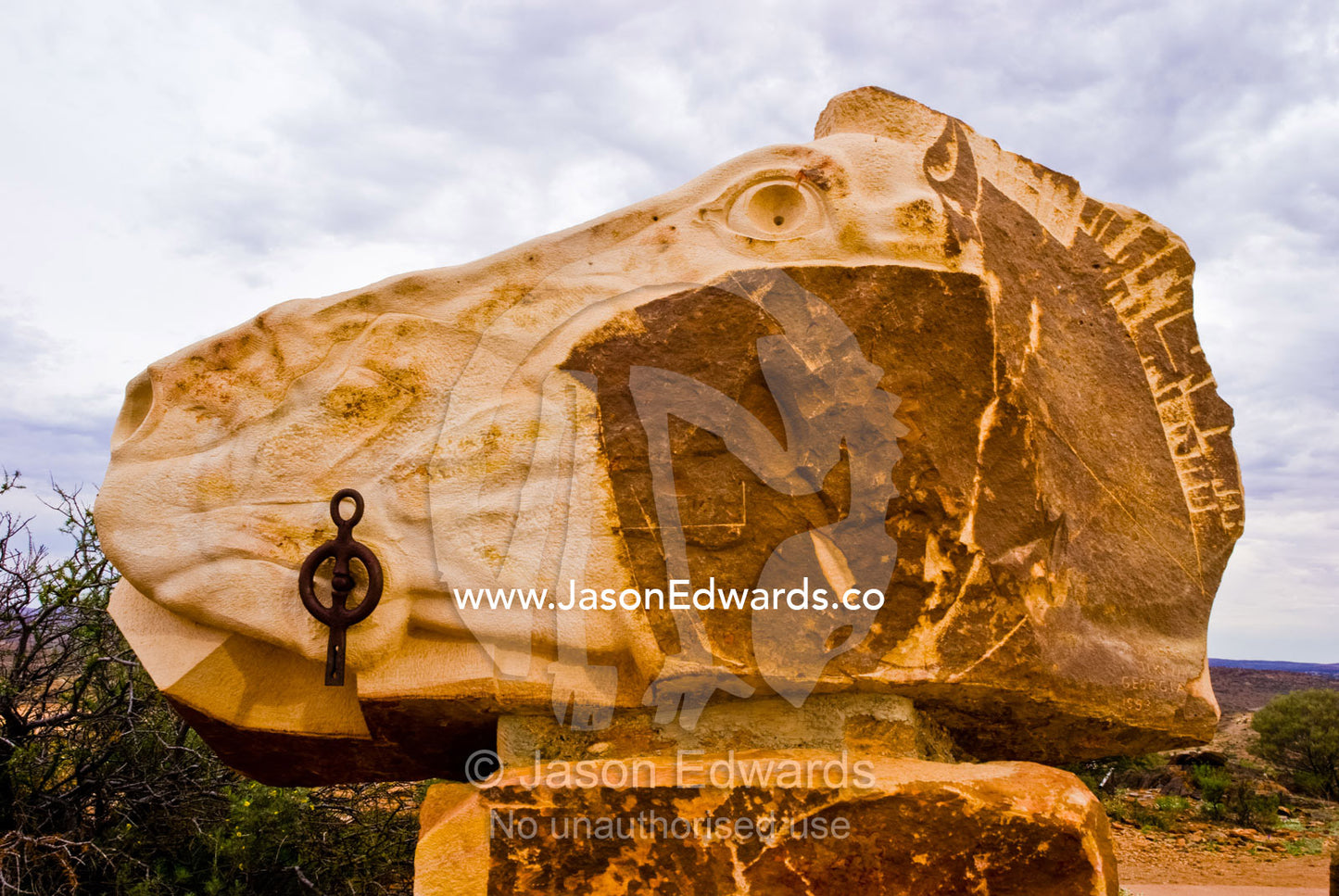 A stone sculpture carved into the form of a horse head in the desert. Living Desert Flora and Fauna Sanctuary, Barrier Ranges, Broken Hill, New South Wales, Australia.