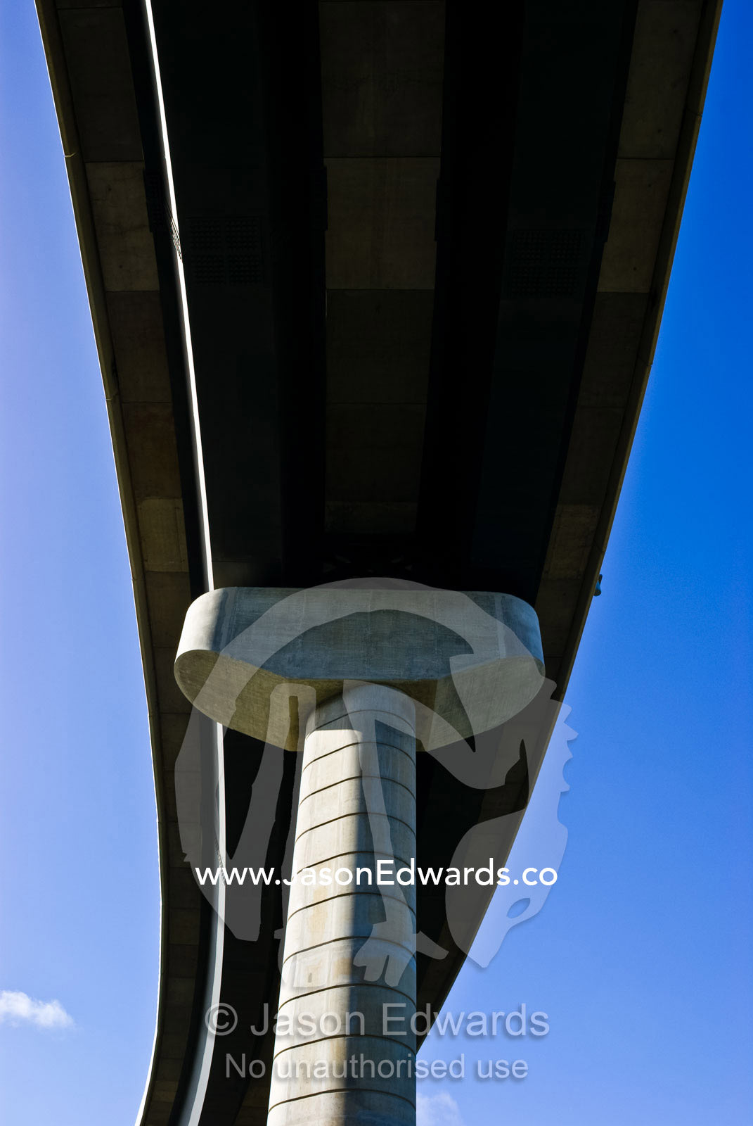 An architecturally designed concrete freeway pillar and overpass. Monash Freeway, Mulgrave, Victoria, Australia.