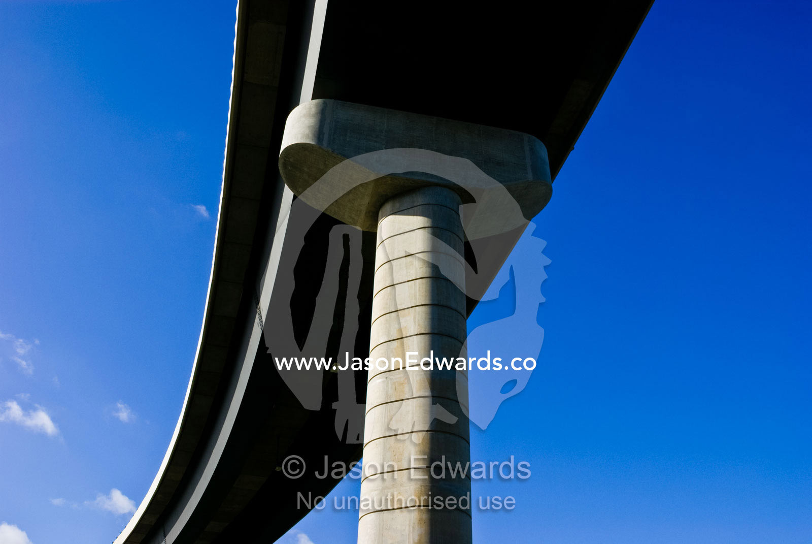 An architecturally designed concrete freeway pillar and overpass. Monash Freeway, Mulgrave, Victoria, Australia.