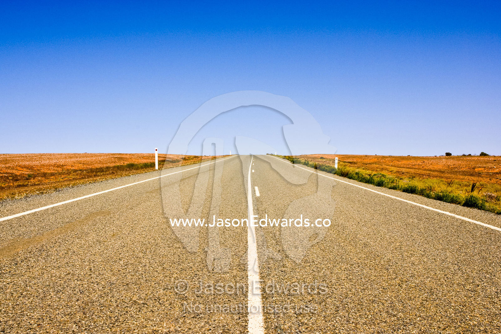A lonely open stretch of road disappears over the desert horizon. near Stephens Creek, outback western New South Wales, Australia.