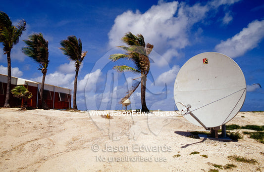 A satellite dish on a remote tropical island cyclone research station. Australian Bureau of Meteorology Meteorological Station, Willis Island, Coral Sea Island Territory, Australia.