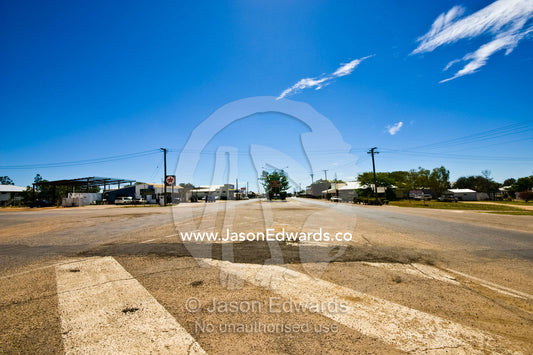 The empty main street of a remote Outback town during rush hour. Hughenden, Queensland, Australia