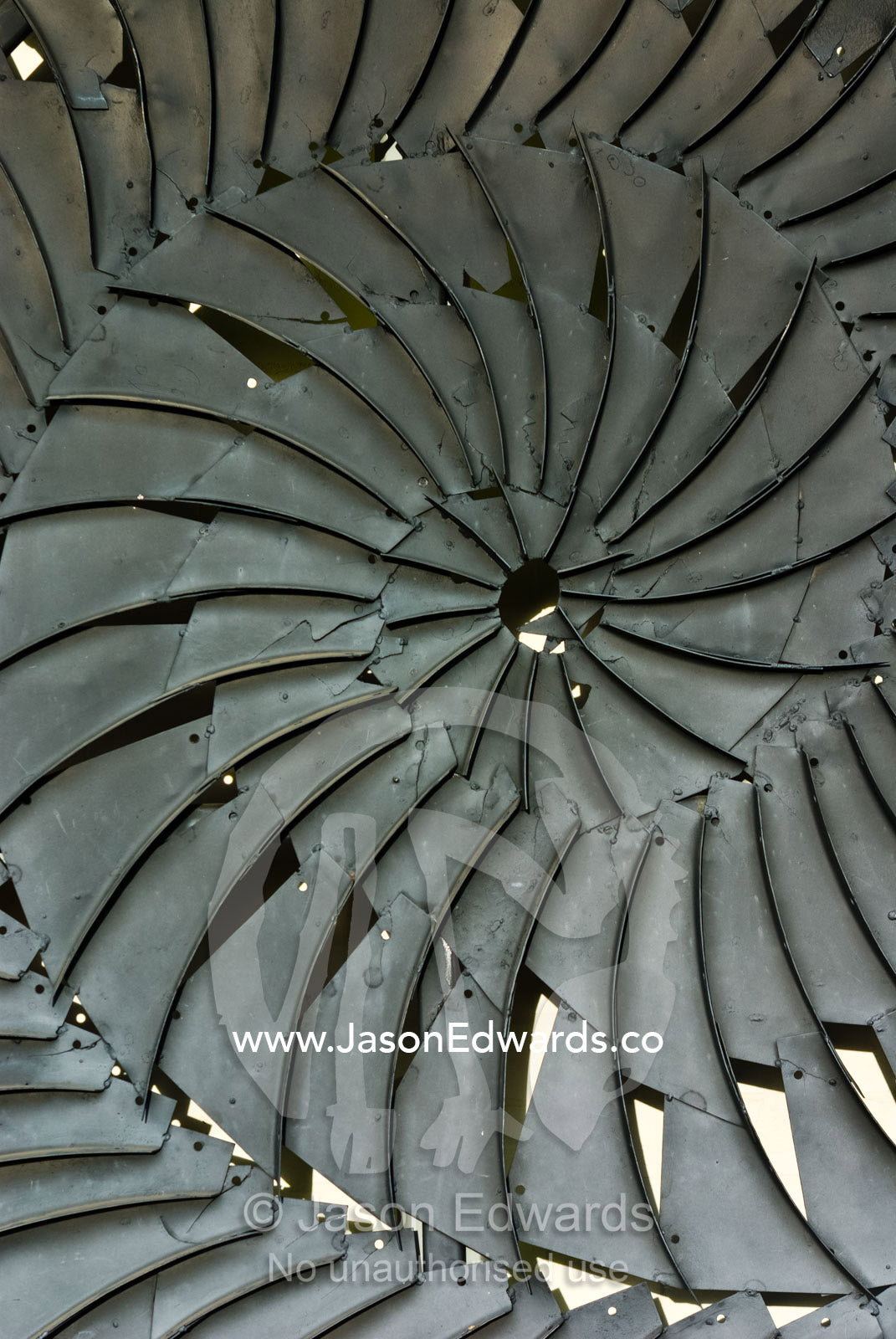 A steel plate public art sculpture depicts the spirals of an ammonite. Hughenden, Queensland, Australia