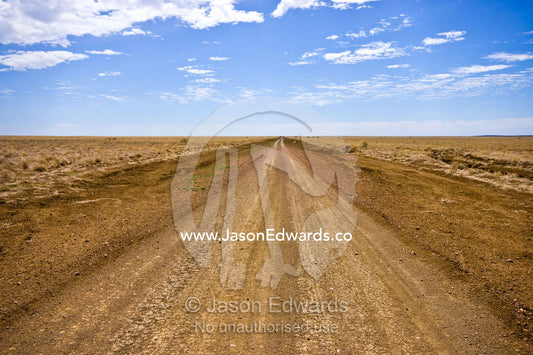 A rough dirt track constitutes a major arterial road in the Outback. Hughenden Muttaburra Road, Queensland, Australia