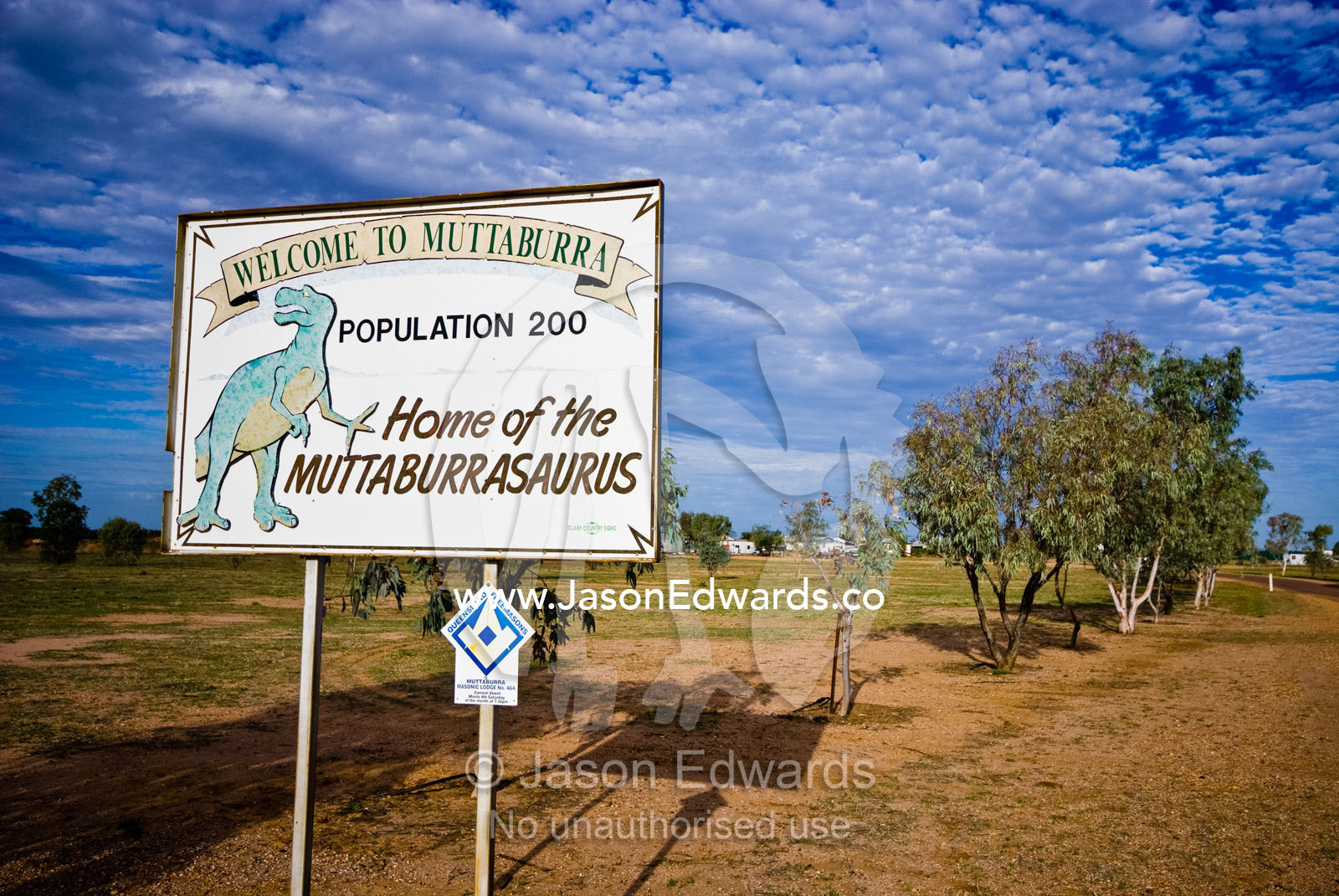 A welcome sign in a tiny Outback town displays a dinosaur discovery. Muttaburra, Queensland, Australia