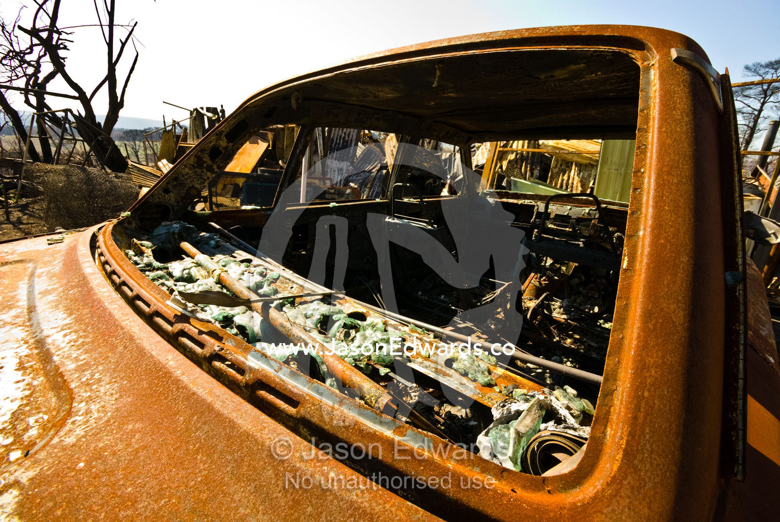 Intense heat from a forest fire melted the rear windscreen of this car Near Humevale, Kinglake National Park, Victoria, Australia