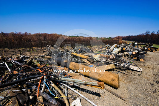 Discarded telephone and electricity supply cables destroyed by a fire. near Hazeldene, Victoria, Australia
