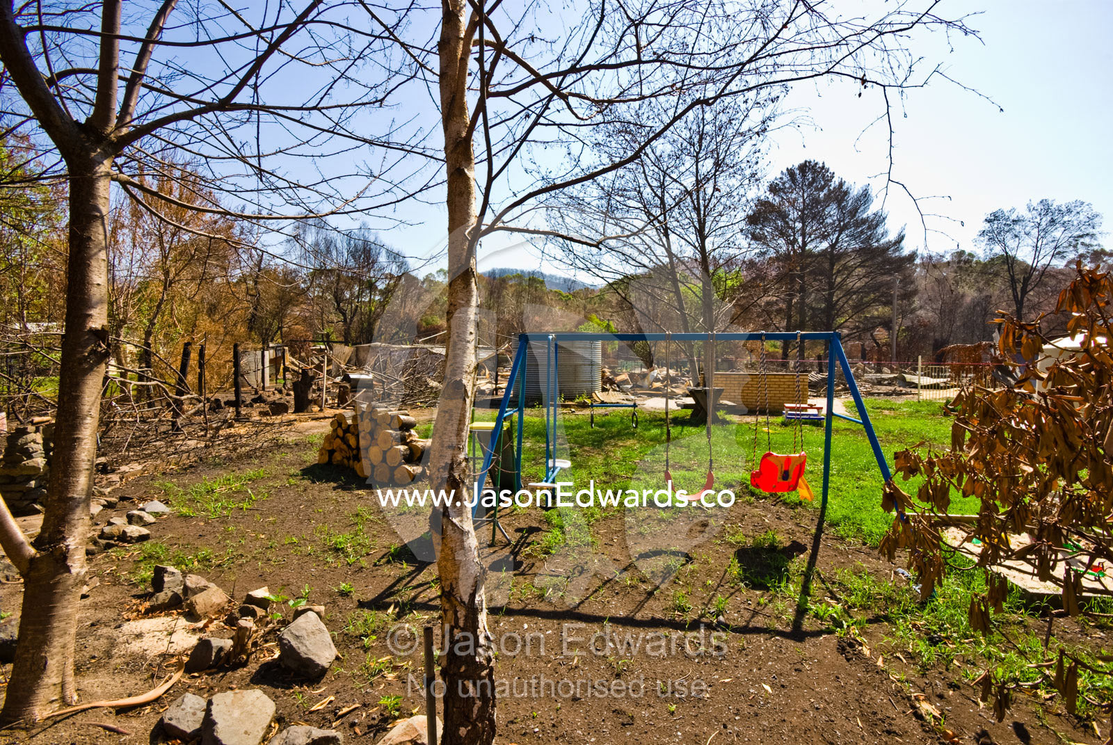 A childs swing survived the fire that destroyed the house and property Hazeldene, Victoria, Australia