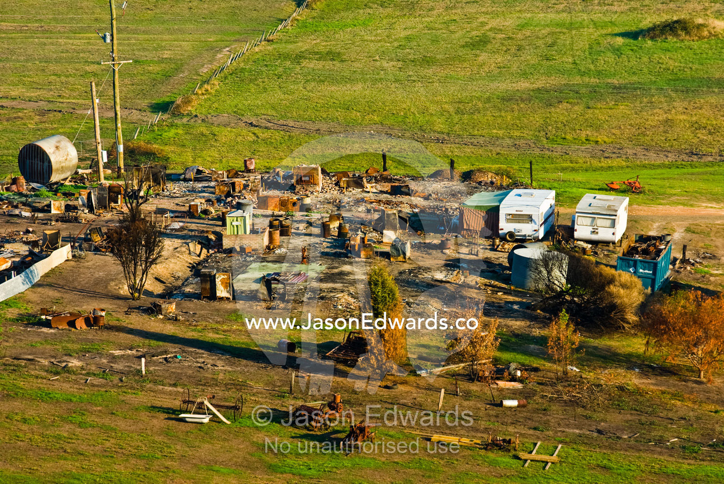 An aerial view of a farming property destroyed by a forest fire. Near Humevale, Kinglake National Park, Victoria, Australia