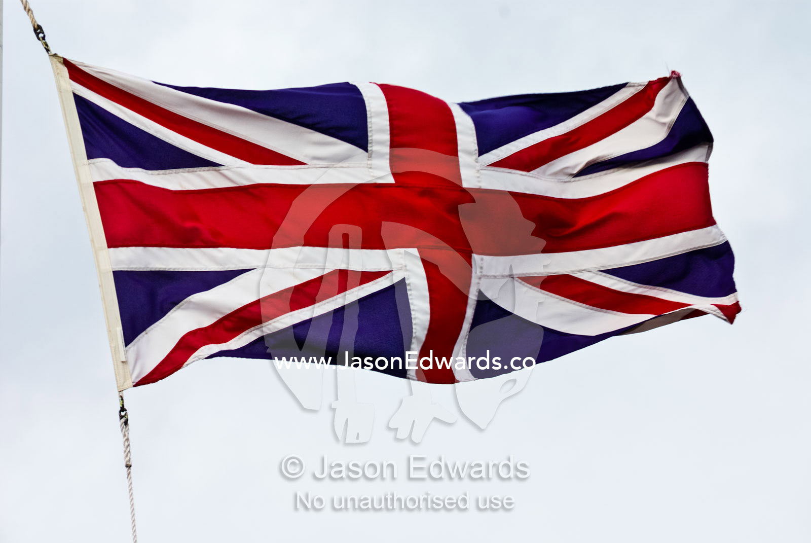 The British Union Jack flag flaps proudly in a stiff wind. Sovereign Hill, Ballarat, Victoria, Australia.