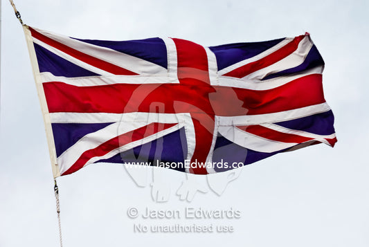 The British Union Jack flag flaps proudly in a stiff wind. Sovereign Hill, Ballarat, Victoria, Australia.