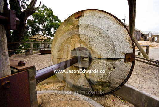 A large granite wheel used for crushing and grinding ore at gold mine. Ballarat, Victoria, Australia.