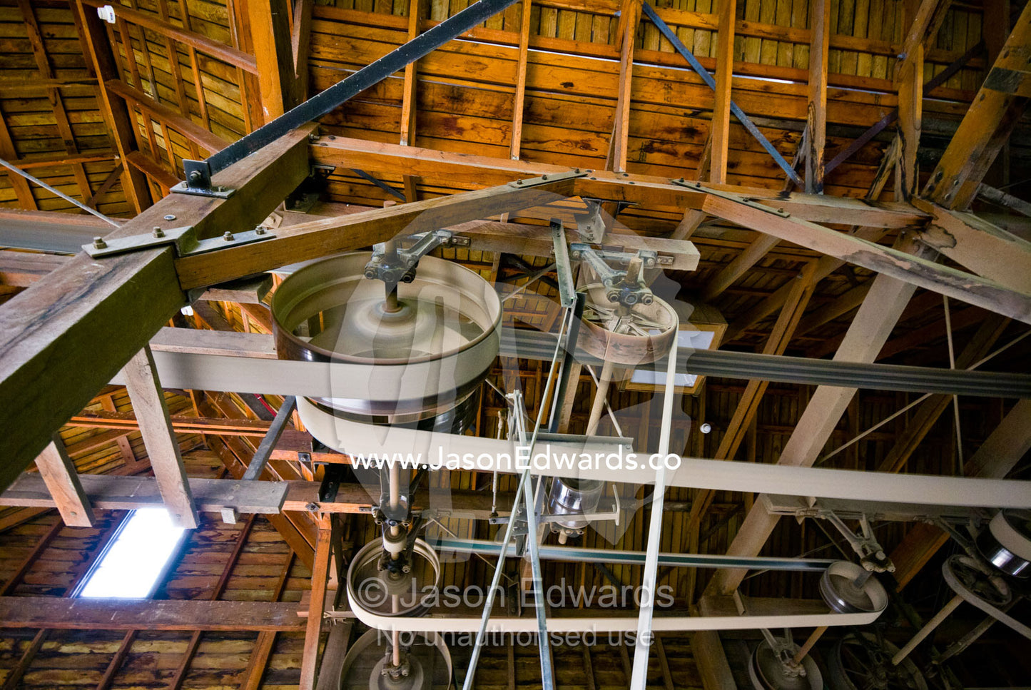 Large belts on pulleys on a wheelwright's plant throating machine. Ballarat, Victoria, Australia.