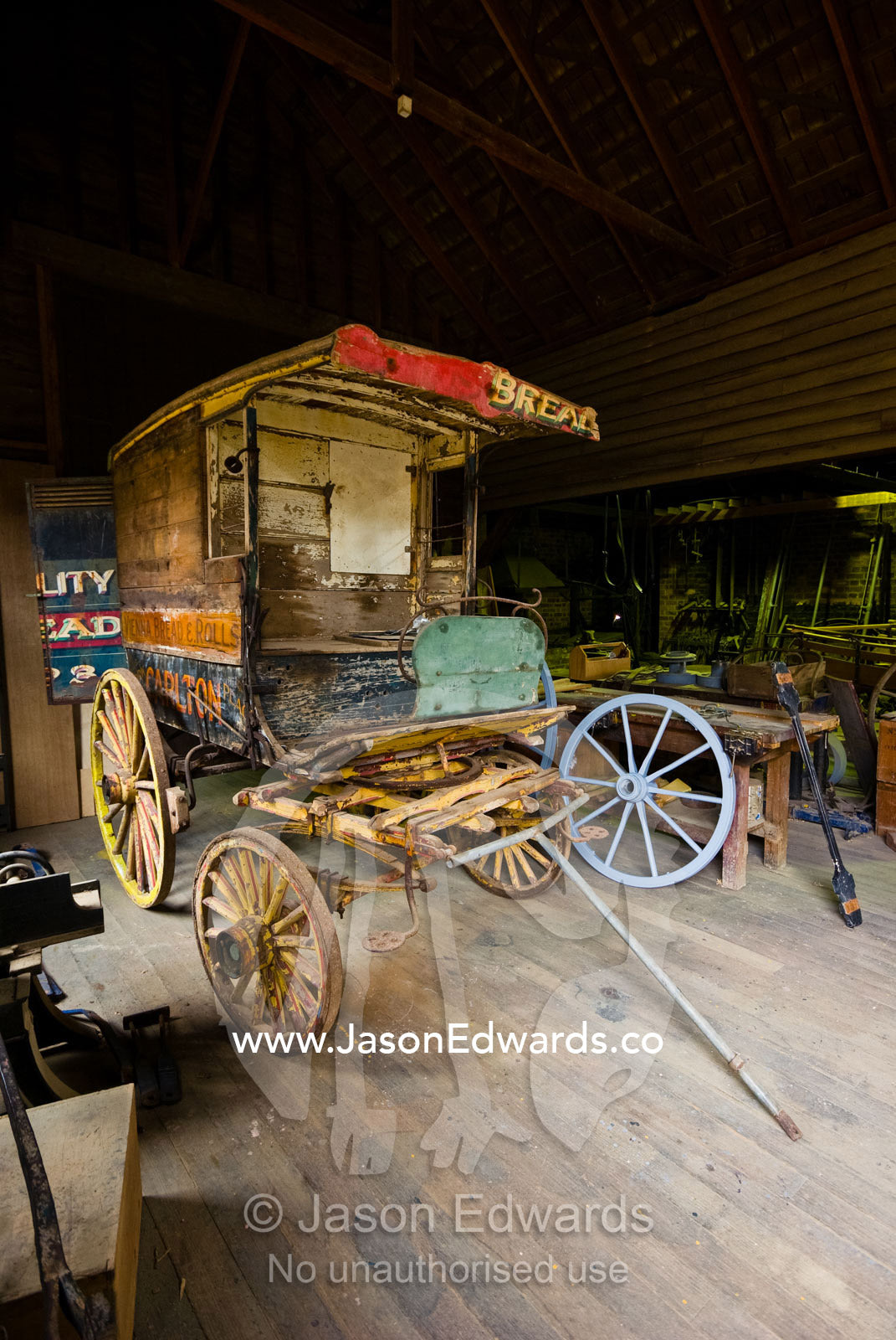 An antique stagecoach wagon being restored by skilled tradesmen. Ballarat, Victoria, Australia.
