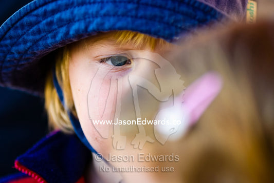 A little boy stares seriously at a little girl in a dispute over a toy Werribee Open Range Zoo, Werribee, Victoria, Australia