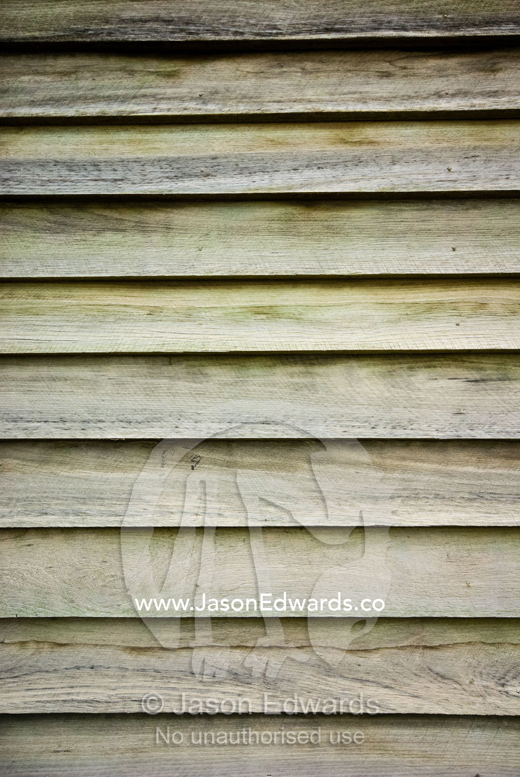 Pine timber slats overlap and seal one another on a workshop wall. Mount Pleasant, Victoria, Australia