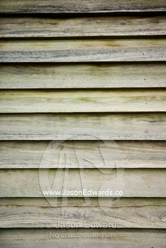 Pine timber slats overlap and seal one another on a workshop wall. Mount Pleasant, Victoria, Australia