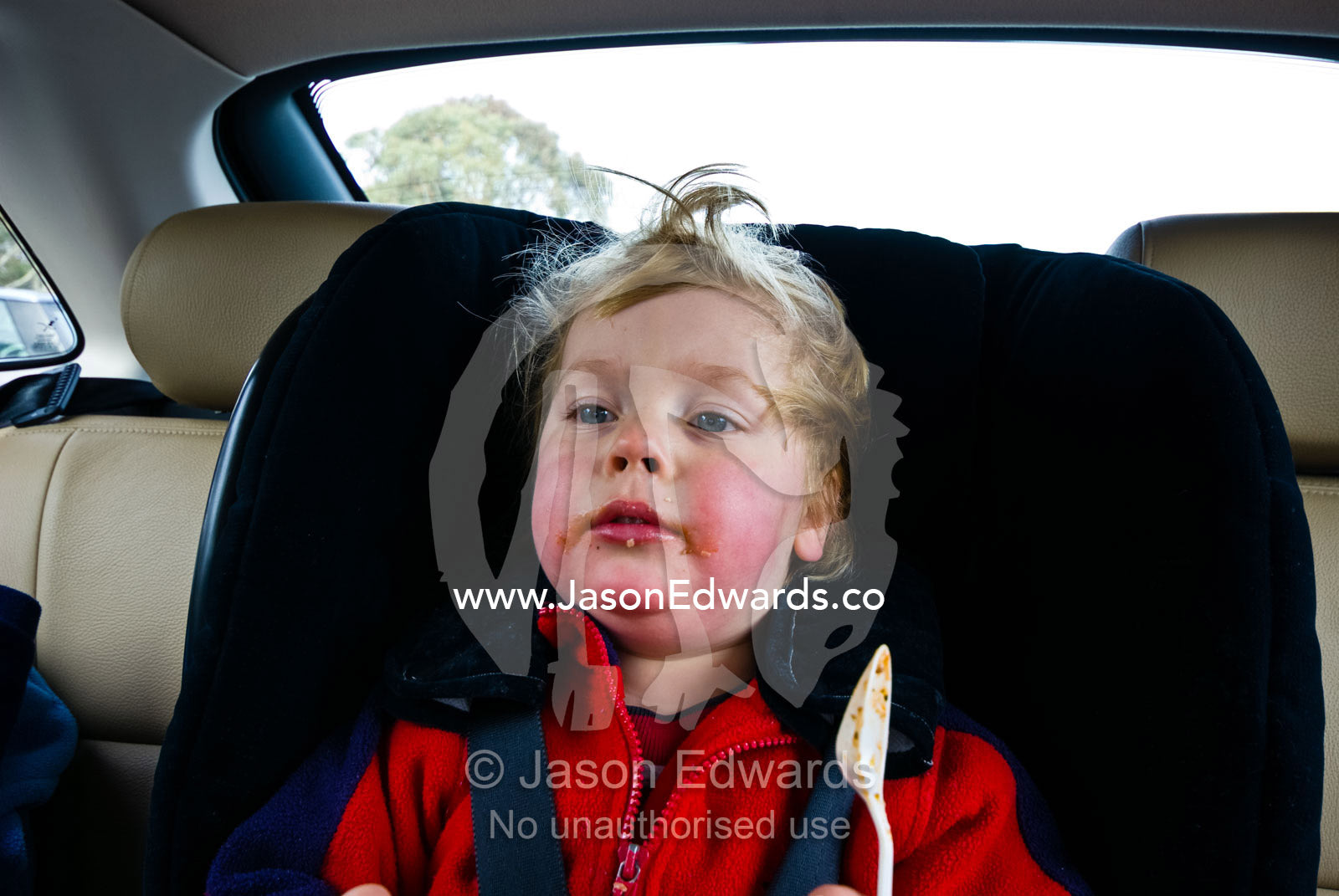 A small boys cheeks glow rosy pink after a day playing in the snow. Dinner Plain, Great Dividing Range,Victoria, Australia
