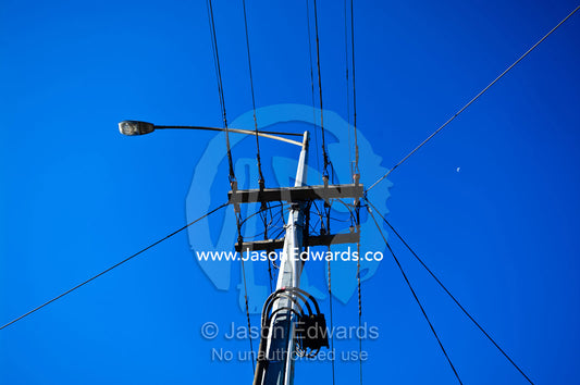 Street lighting and electricity cables attached to a steel pole. Carlton North, Victoria, Australia