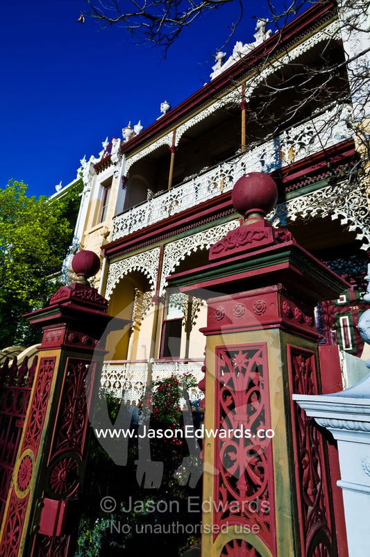 Ornate steel gate pillars and intricate lattice on a Victorian terrace Carlton North, Victoria, Australia