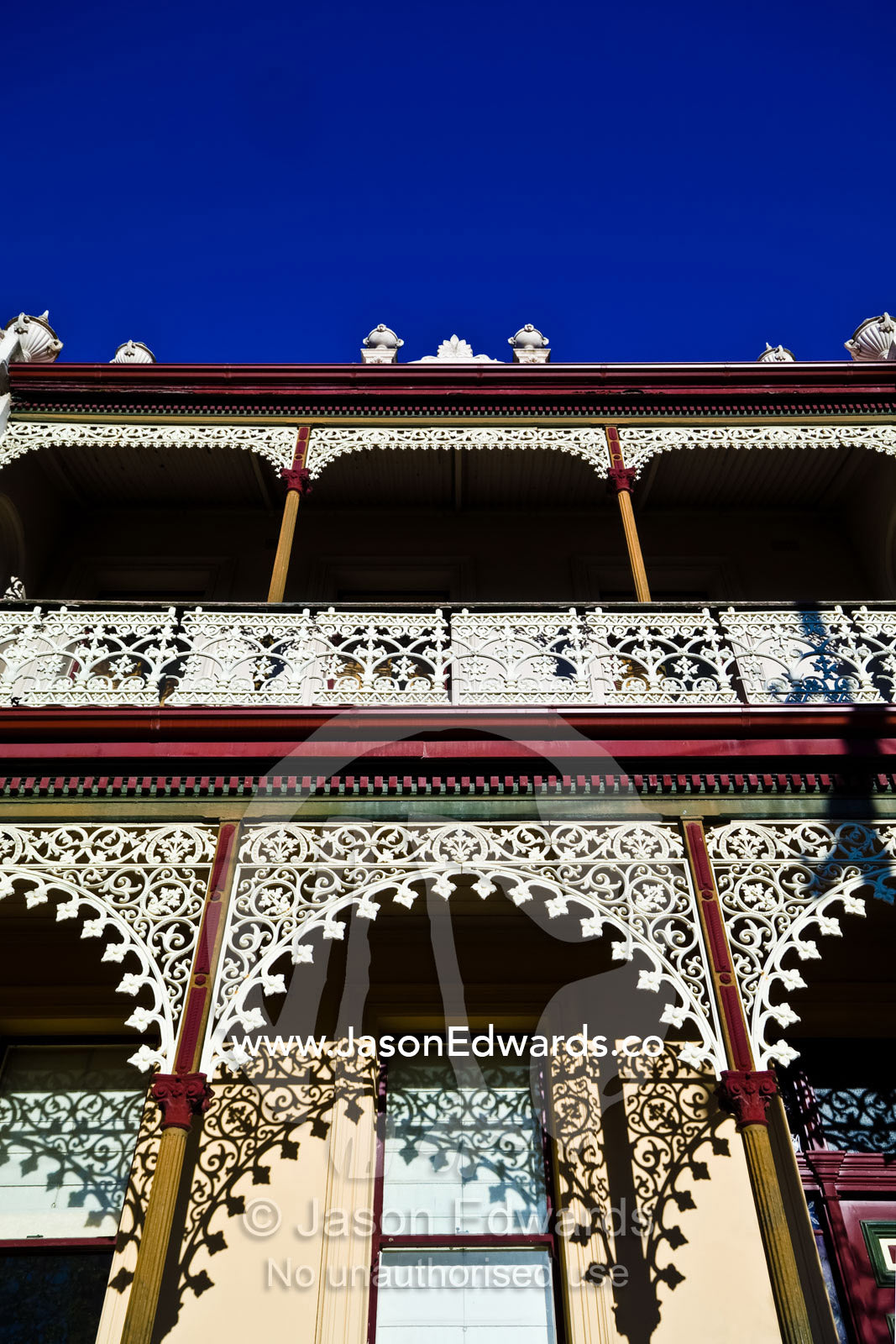 Ornate steel lattice on an English Victorian terrace balcony verandah. Carlton North, Victoria, Australia
