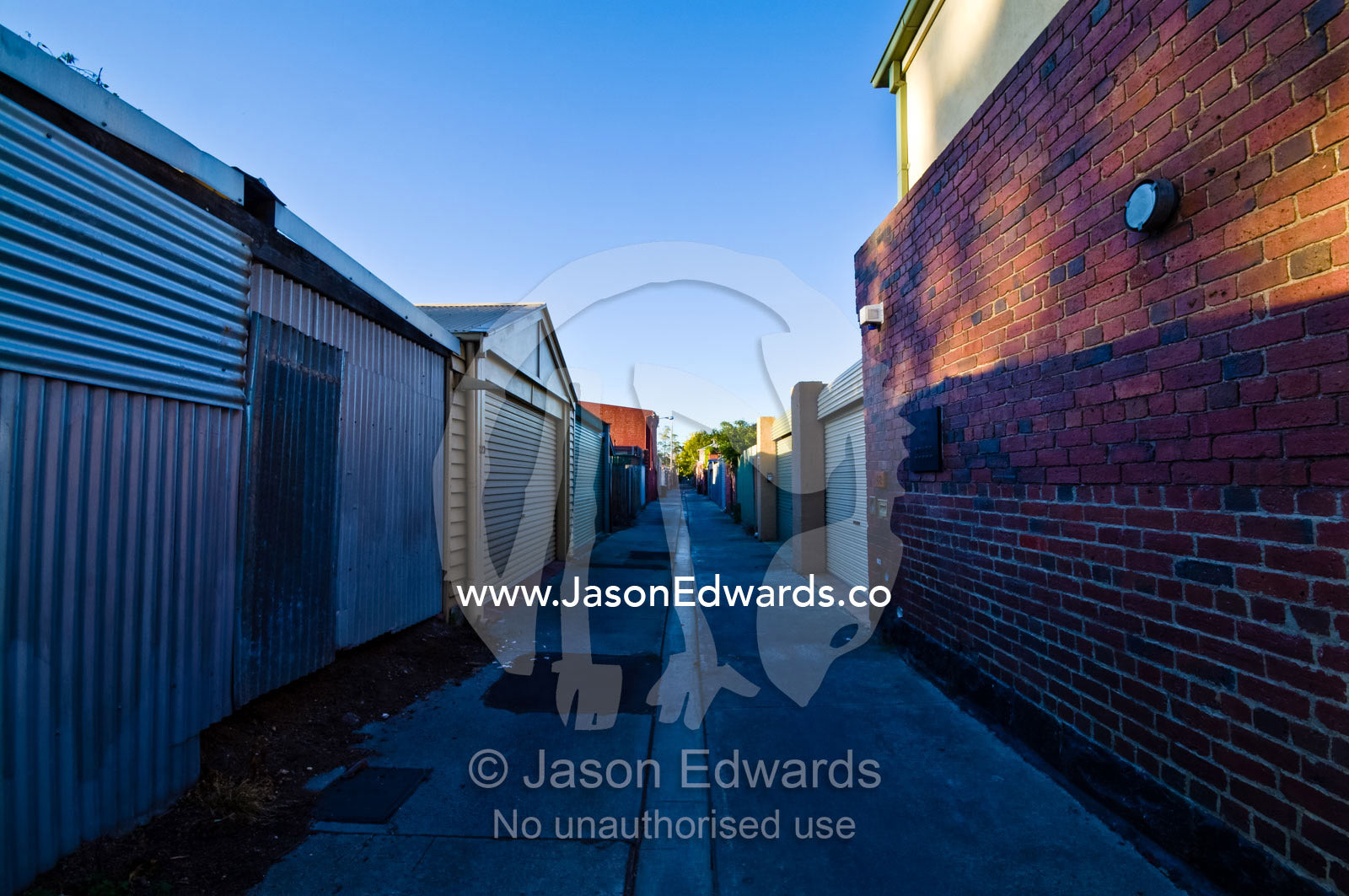 Houses and garages back onto a lane in an inner city suburb. Carlton North, Victoria, Australia