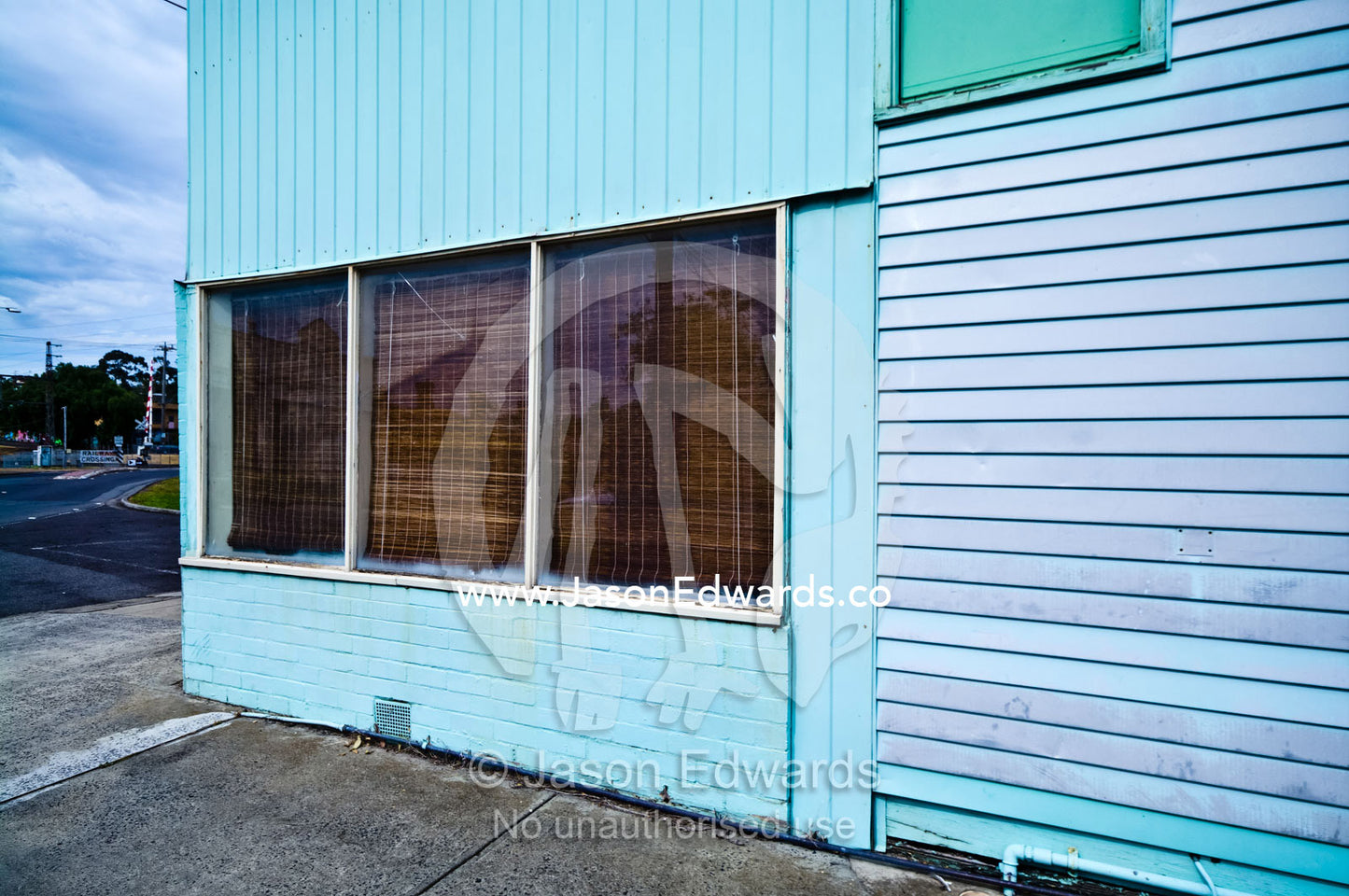 An old weatherboard corner store painted blue and turned into a house. Fitzroy North, Victoria, Australia