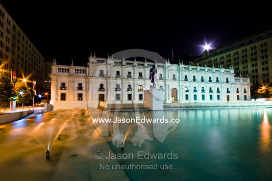 Fountains spray in a pool in Citizenry Square by Palacio de La Moneda. Statue of the President Arturo Alessandri, Plaza de la Ciudadan��a, Citizenry Square, Palacio de La Moneda, Palace La Moneda, Santiago, Chile