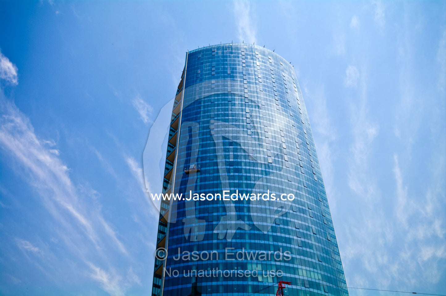 The cylindrical steel and glass facade of Santiago's tallest building. Millenium Building, Torre la Portada, Providencia, Santiago, Chile