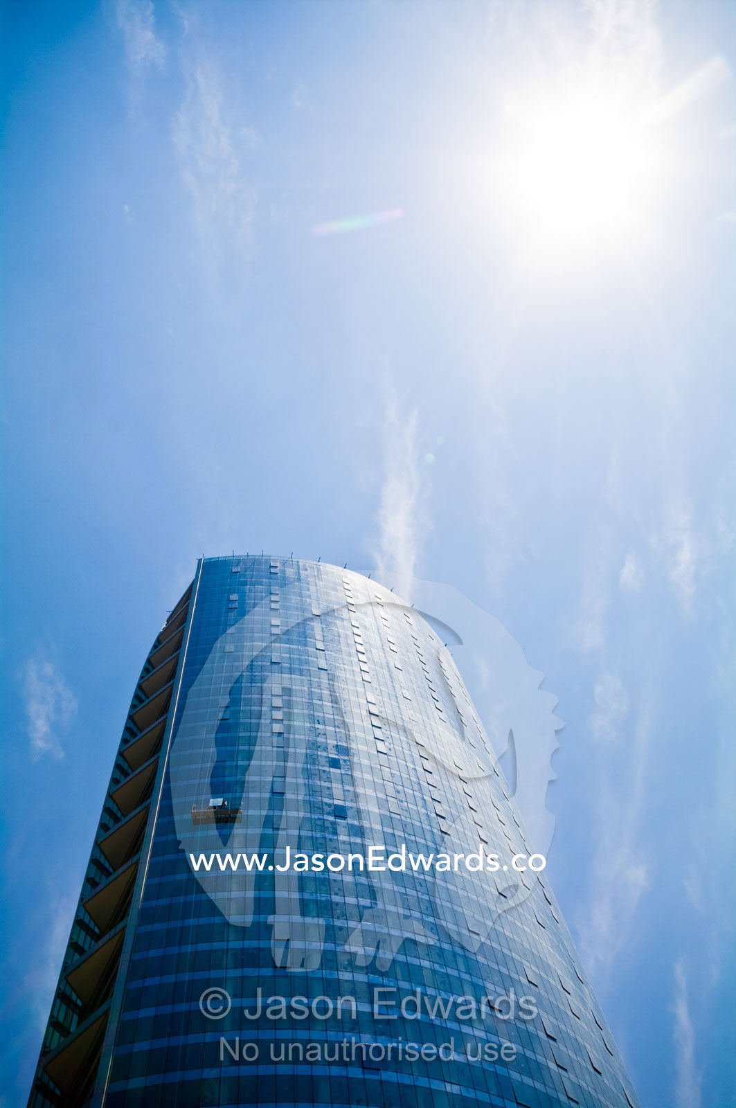 The cylindrical steel and glass facade of Santiago's tallest building. Millenium Building, Torre la Portada, Providencia, Santiago, Chile