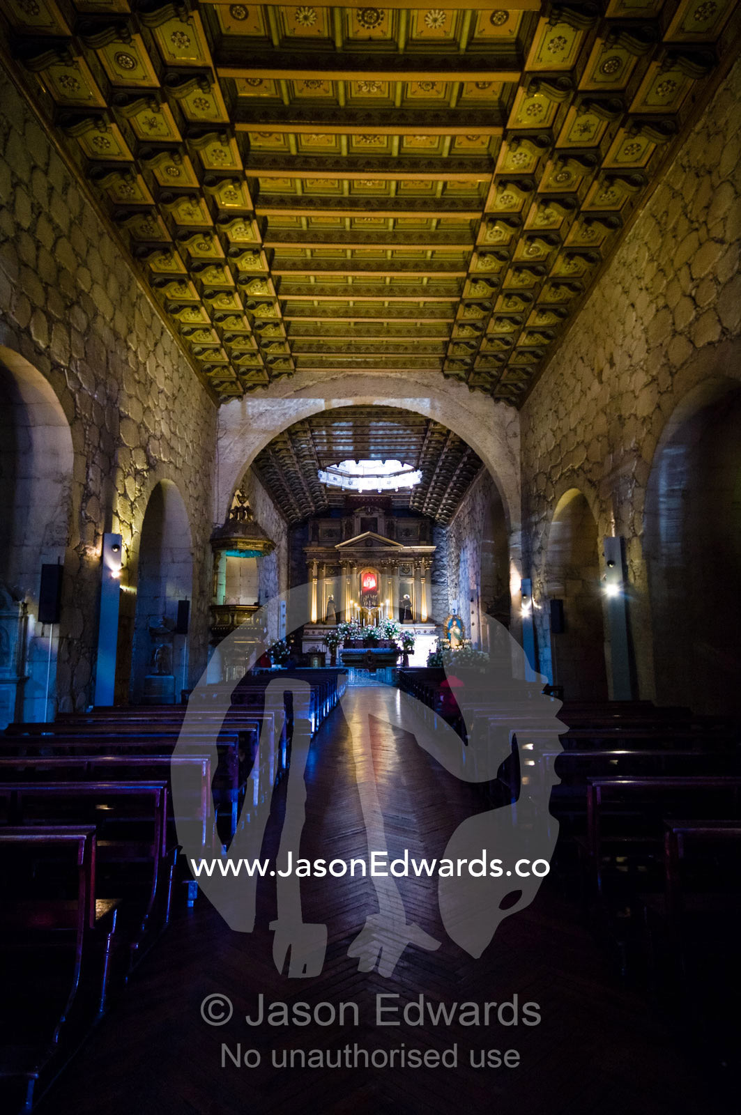 Stones, a stuccoed ceiling and timber corbels in a church central nave Iglesia San Francisco, Santiago, Chile