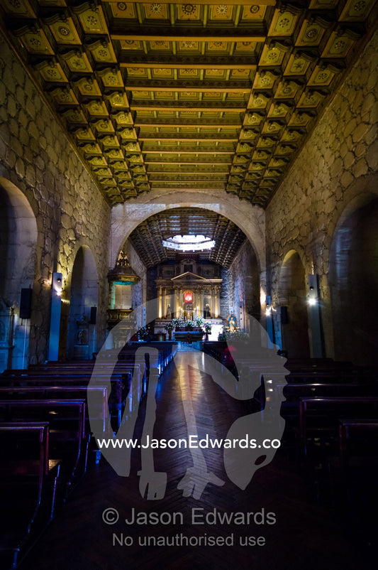 Stones, a stuccoed ceiling and timber corbels in a church central nave Iglesia San Francisco, Santiago, Chile