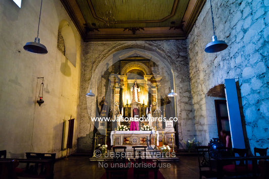 An ornate Catholic temple in a cloister adjacent to the central nave. Iglesia San Francisco, Santiago, Chile