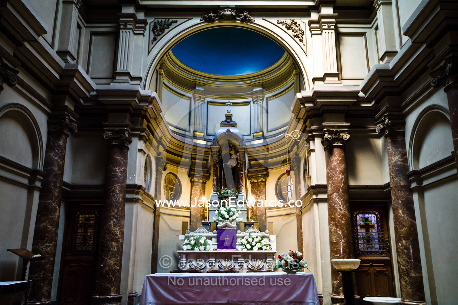 An ornate Catholic temple in a cloister adjacent to the central nave. Iglesia San Francisco, Santiago, Chile