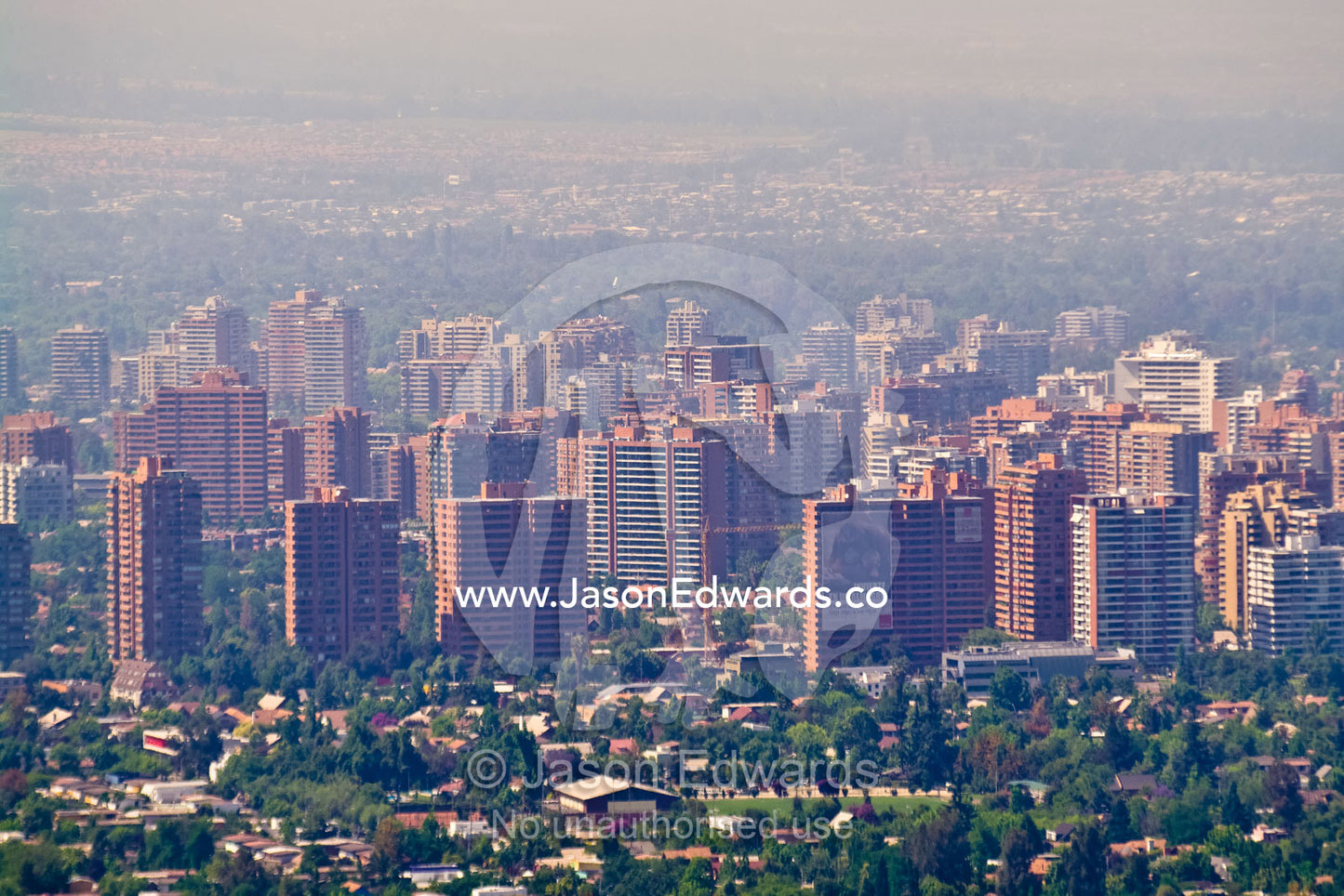 Summer smog and pollution in Santiago's suburbs and business district. Residencial Las Condes from Santa Maria de Manquehue, Santiago, Chile