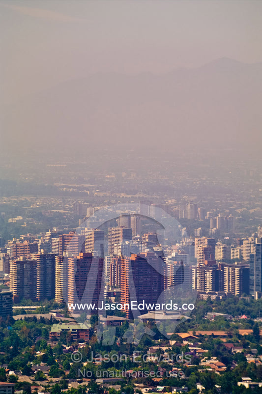 Summer smog and pollution in Santiago's suburbs and business district. Residencial Las Condes from Santa Maria de Manquehue, Santiago, Chile