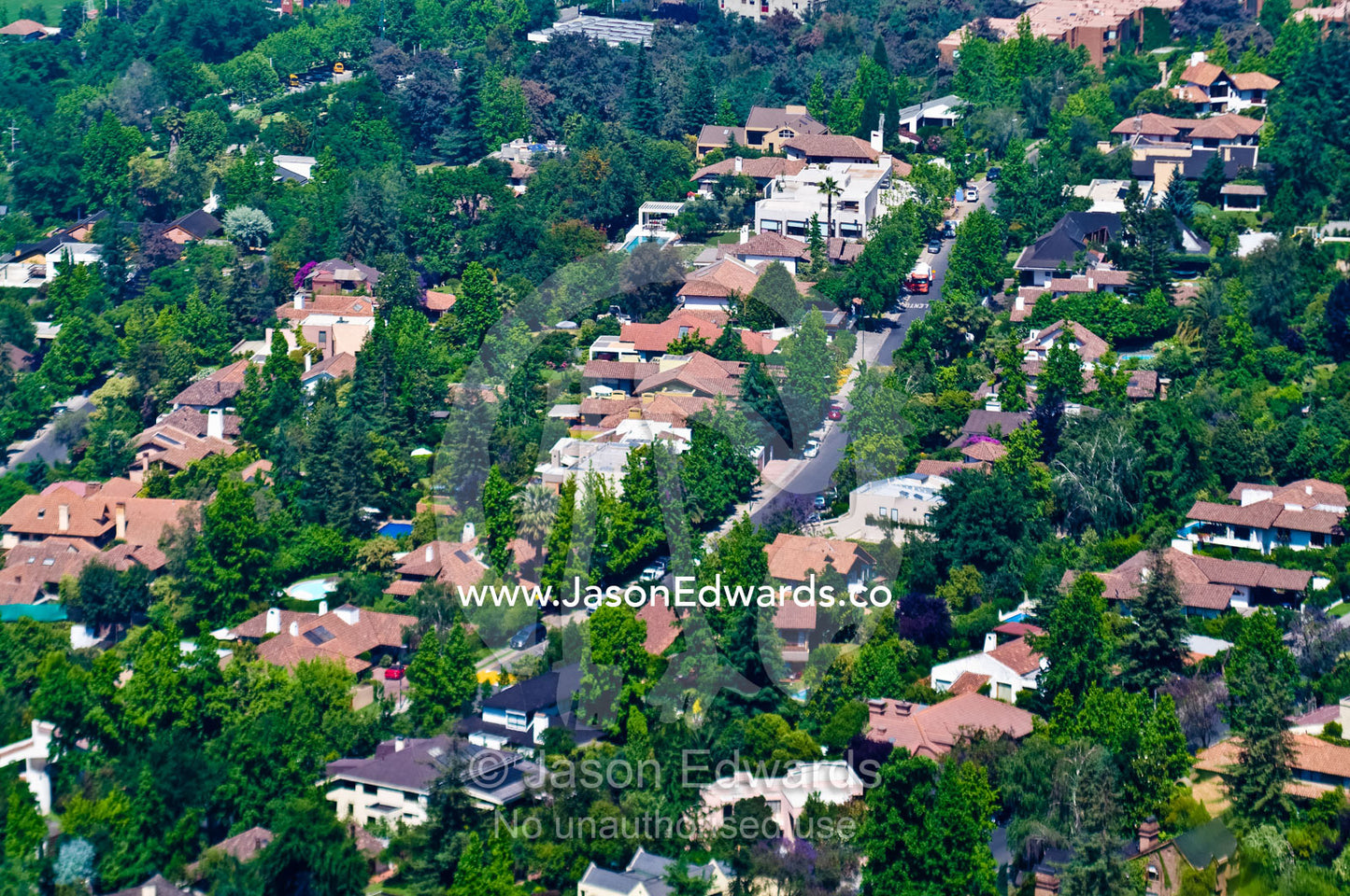 The tree-lined streets and large homes of a wealthy suburb in Santiago Santa Maria de Manquehue, Santiago, Chile